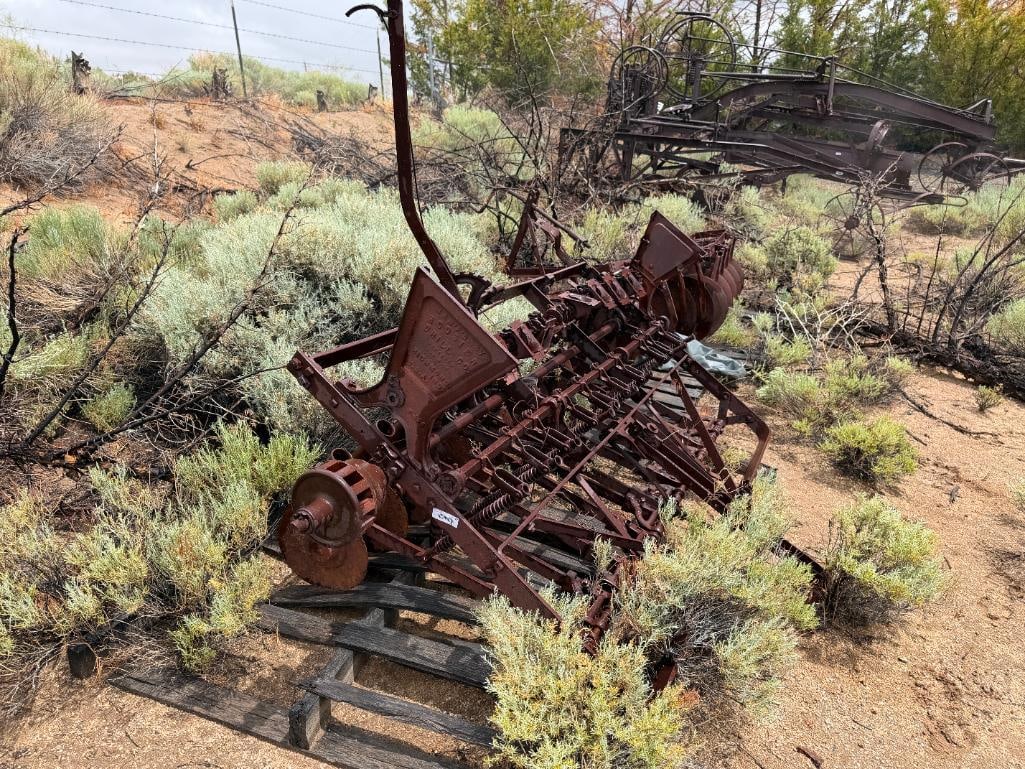 ANTIQUE TRACTOR DRAWN HOOSIER SEED DRILL FARMING IMPLEMENT: FOUNDED BY JOHN M. WESCOTT IN MILTON, INDIANA, USED TO SOW SEEDS IN PRECISE ROWS, RUSTED FROM WEATHER, YARD ART, MARKED HOOSIER DRILL CO. RICHMOND, INDIANA, "F-484" 128" X 72" APPROX. TOTAL