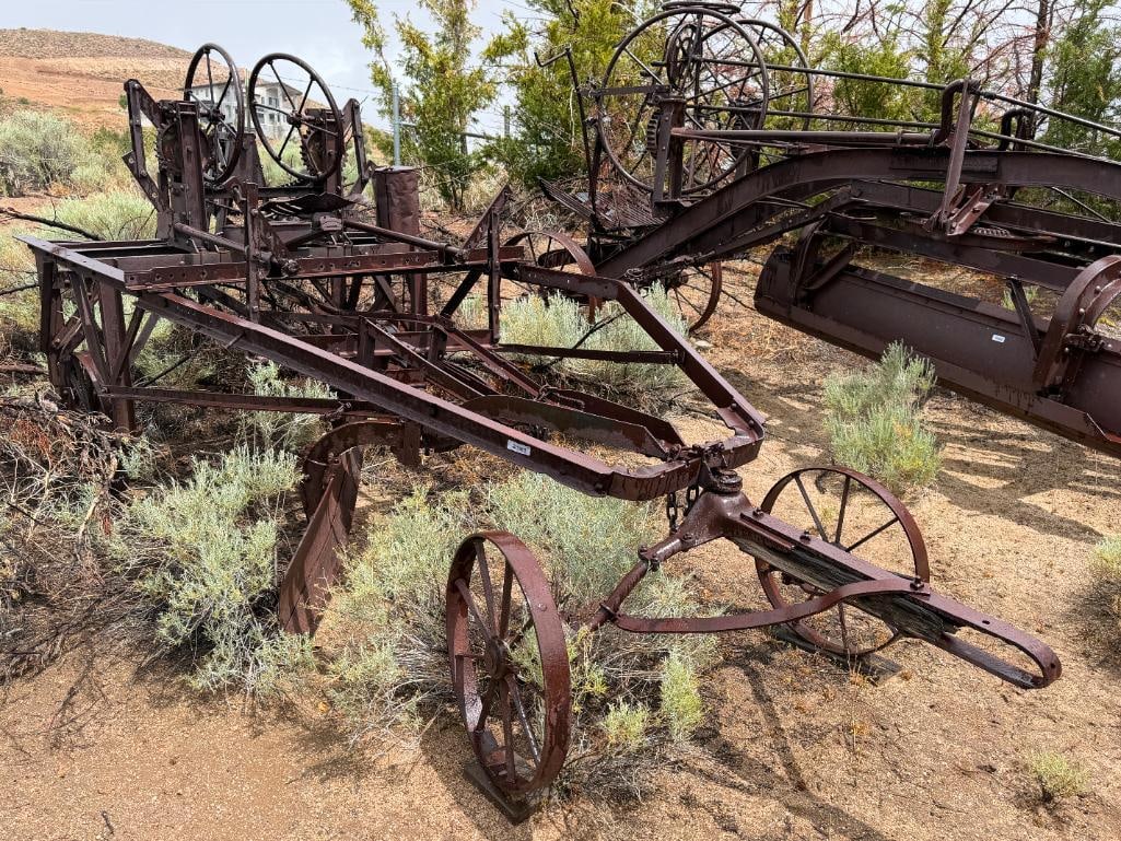 ANTIQUE 1885 TRACTOR DRAWN LEANING WHEEL ROAD GRADER BY J.D. ADAMS & CO. INDIANAPOLIS, INDIANA: FEATURING MAKER'S INSIGNIA CAST IN STEEL, CIRCA 1885, FIRST SUCCESSFUL PULL GRADER TO EMPLOY LEANING WHEEL PRINCIPLE 224" X 72" X 74" APPROX. TOTAL DIMENSIONS, 7FT PLOW, 26" WHEELS
