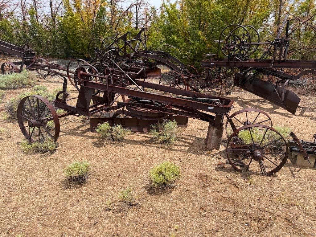 ANTIQUE THE RUSSELL GRADER MFG. CO. THE RUSSELL JUNIOR ROAD GRADER MADE IN MINNEAPOLOIS, MINNESOTA: TRACTOR DRAWN, ANTIQUE 20TH CENTURY FARMING IMPLEMENT, CIRCA 1910'S, PIONEER IN ROAD CONSTRUCTION FEATURING A 6FT BLADE, 32" WHEELS, APPROX. 196" X 72" X 60" APPROX. TOTAL DIMENSIONS