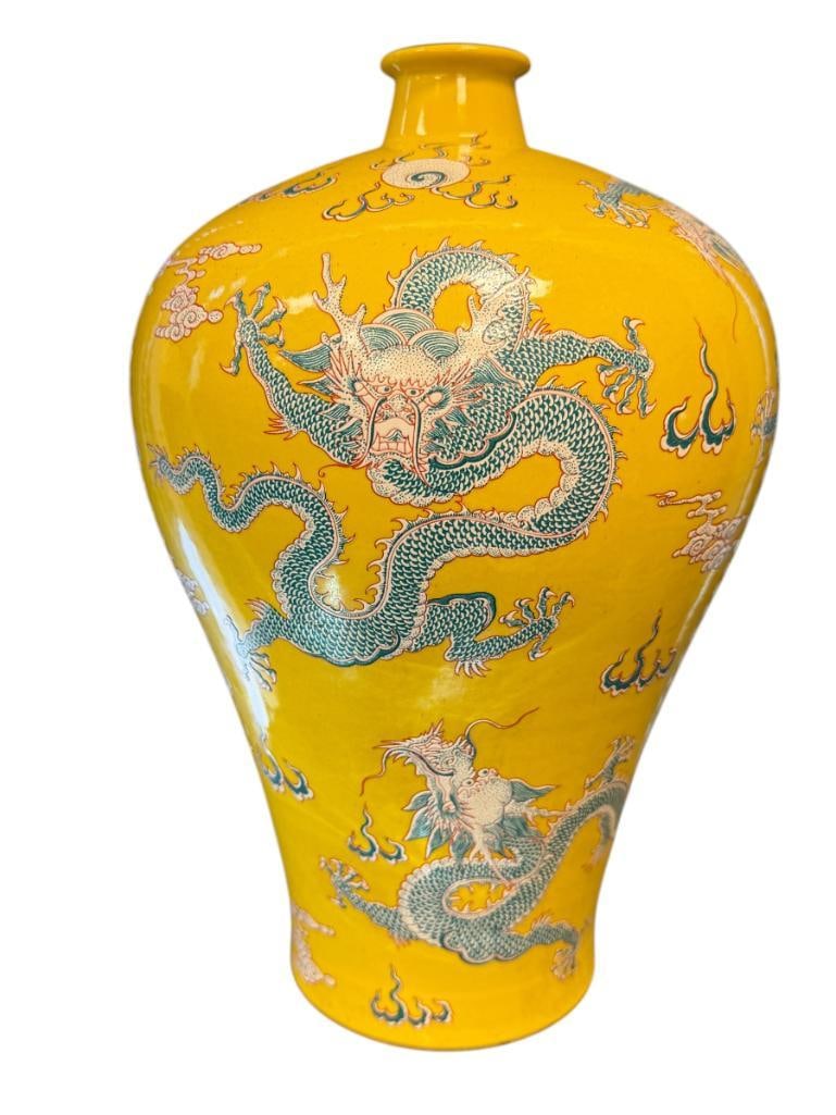 20TH CENTURY CHINESE PORCELAIN VASE WITH YELLOW GLAZE DRAGON AND CLOUD DESIGN WITH QIANLONG MARK: TALL BULBOUS VASE WITH DRAGON AN CLOUD MOTIF IN GREEN AND WHITE WITH VIBRANT YELLOW BACKGROUND, MARKED ON THE BOTTOM, NO CHIPS OR CRACKS 13 3/4" H