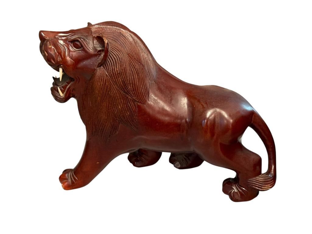 FEROCIOUS LION CARVED WOOD ANIMAL FIGURINE WITH BONE FANGS: CARVED WOOD LION 8 1/2" H, 11 3/8" L