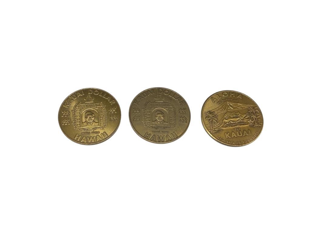 THREE 1973 ALOHA "THE GARDEN ISLE" KAUAI, HAWAII CHAMBER OF COMMERCE DOLLARS: BRASS COMPOSITION, "SLEEPING GIANT" 1 1/2"