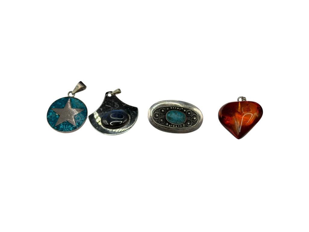 FOUR FASHION JEWELRY PENDANTS INCLUDING STERLING SILVER ISRAEL MADE PENDANT, AMBER, AND MORE: ALSO INCLUDES LABRADORITE PENDANT MARKED MADE IN FINLAND AND MEXICO DESIGN SILVERPLATED STAR PENDANT LARGEST IS 1 1/4"