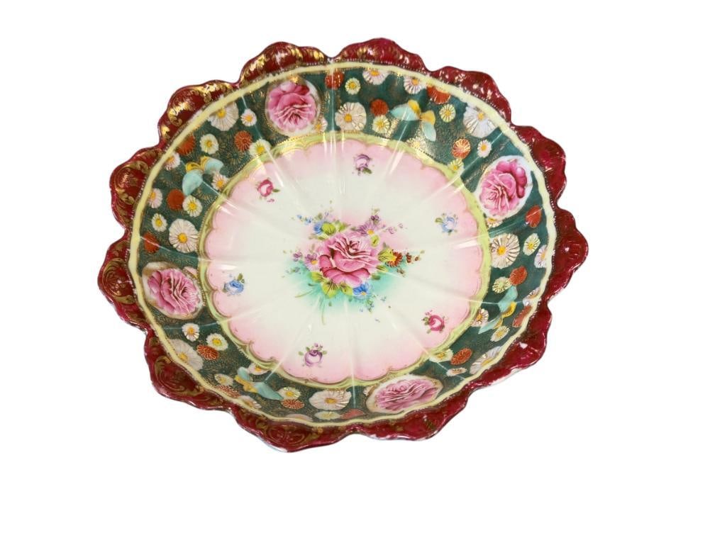 ANTIQUE JAPANESE PORCELIAN HAND PAINTED SCALLOPED EDGE BOWL FLORAL DESIGN WITH GILT ACCENTS: TWO TONE GREEN AND RED BOWL WITH FLORAL DESIGN, HEAVY GILT ACCENTS, MARKED ON THE BOTTOM, NO CHIPS OR CRACKS, DOES SHOW LIGHT WEAR 9 3/4" ROUND