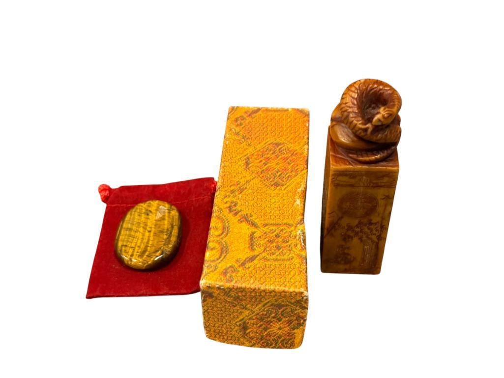 VINTAGE HAND CARVED SOAPSTONE SERPENT CHOP SEAL PERSONALIZED AND POLISHED TIGERS EYE SPECIMEN: CARVED STONE CHOP SEAL WITH LANDSCAPE ON THE SIDES AND SERPENT ON TOP, INCLUDES ORIGINAL BOX AND "THUMBPRINT" POLISHED TIGERS EYE GEODE 1 1/2" GEODE, 3 1/2" SEAL
