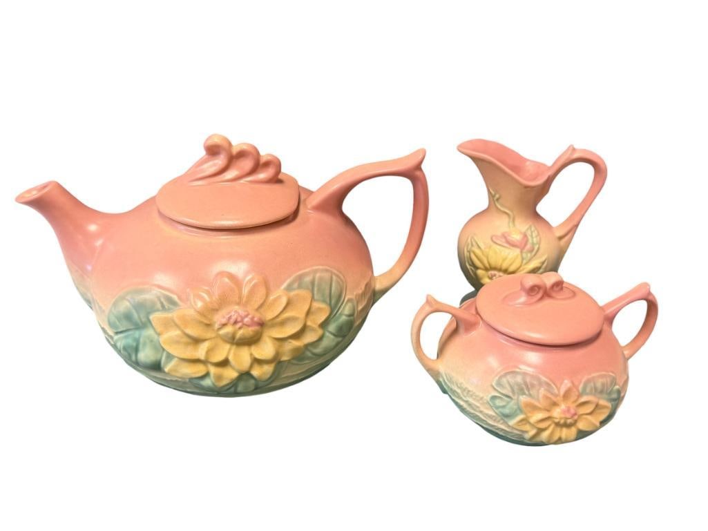 MID-CENTURY HULL ART POTTERY WATER LILY TEAPOT, SMALL PITCHER AND SUGAR BOWL CIRCA 1940'S - 1950'S: TWO TONE PINK / TURQUOISE POTTERY WITH FLORAL RELIEF DESIGN, MARKED ON THE BOTTOM, NO CHIPS OR REPAIRS 9 1/2" TEA POT