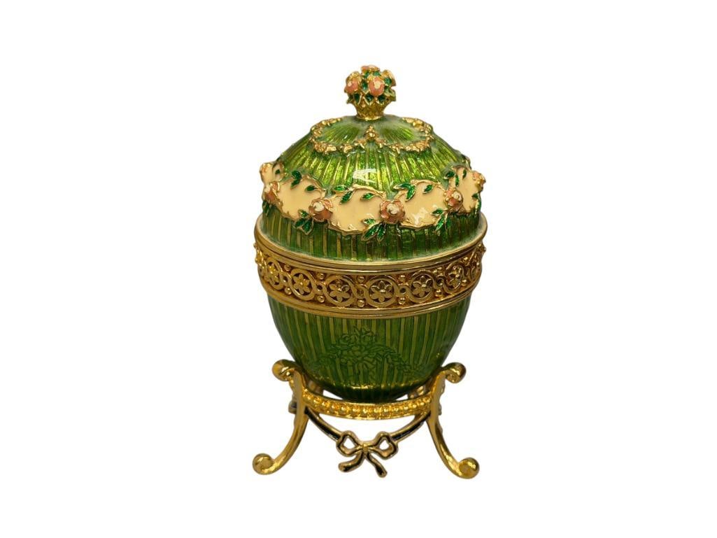 JOAN RIVERS IMPERIAL TREASURES III EGG CLOCK GREEN GUILLOCHE ENAMELED FINISH WITH STAND: FLORAL AND BOW DESIGN, MARKED ON THE BOTTOM 3 3/4" H