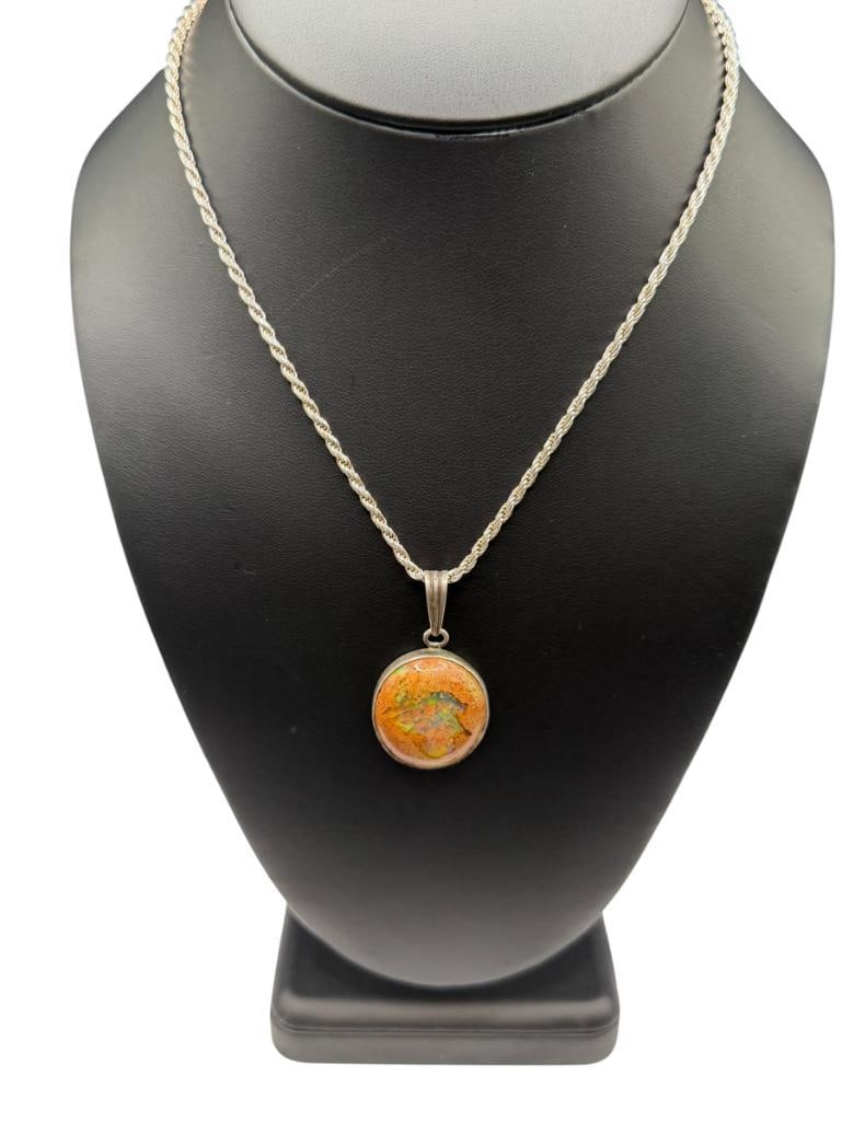 STERLING SILVER MEXICAN FIRE OPAL PENDANT NECKLACE: FEATURING ROUND CABOCHON MEXICAN FIRE OPAL SET ON STERLING SILVER ROPE CHAIN NECKLACE, NECKLACE IS MARKED "MADE IN ITALY" 16" NECKLACE, 1 5/8" PENDANT, 15.71 GRAMS TOTAL