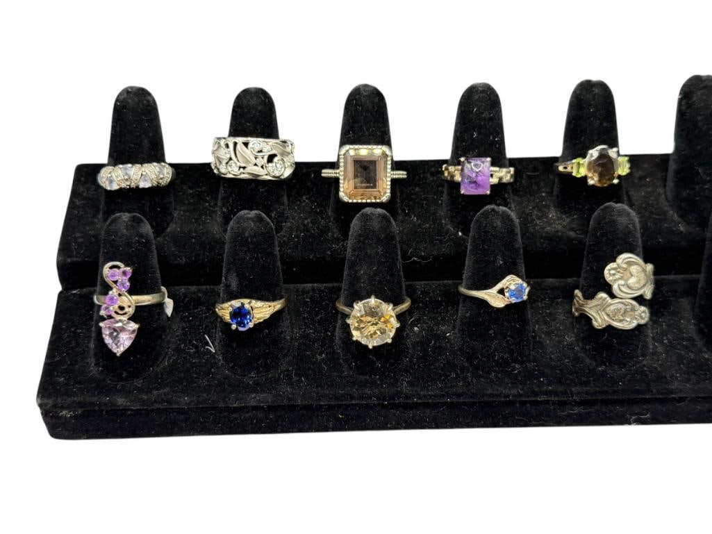 10 STERLING SILVER RINGS ACCENTED WITH VARIOUS STONES AND DESIGNS INCLUDING TANZANITE AND CITRINE: ALSO INCLUDES AMETHYST AND SMOKEY TOPAZ, UNIQUE STYLES VARIOUS SIZES, 45.27 GRAMS