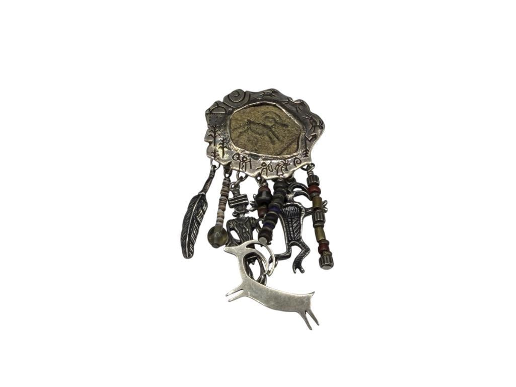 STERLING SILVER CAVE DRAWING DESIGN DANGLE PENDANT SIGNED BY ARTIST "R.S.": UNIQUE DESIGN WITH RUNNING ANIMAL AND FIGURAL CHARM DANGLES 3 1/4", 21.96 GRAMS