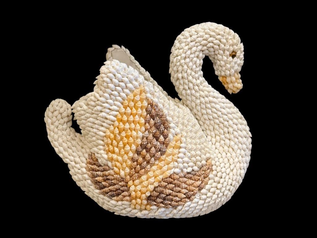 CERAMIC SWAN PLANTER INTRICATELY DECORATED WITH SMALL SEASHELLS: COVERS ENTIRE BODY, MANY SHELLS ARE DAMAGED ALONG THE BOTTOM EDGE 9" H
