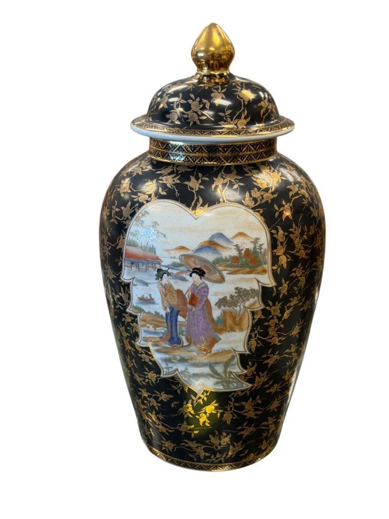 JAPANASE SATSUMA STYLE PORCELAIN GINGER JAR: BLACK AND GOLD DECORATED WITH HAND PAINTED SCENE OF WOMAN AND CHILDREN WITH LANDSCAPE BACKGROUND, MARKED ON THE BOTTOM 20" H