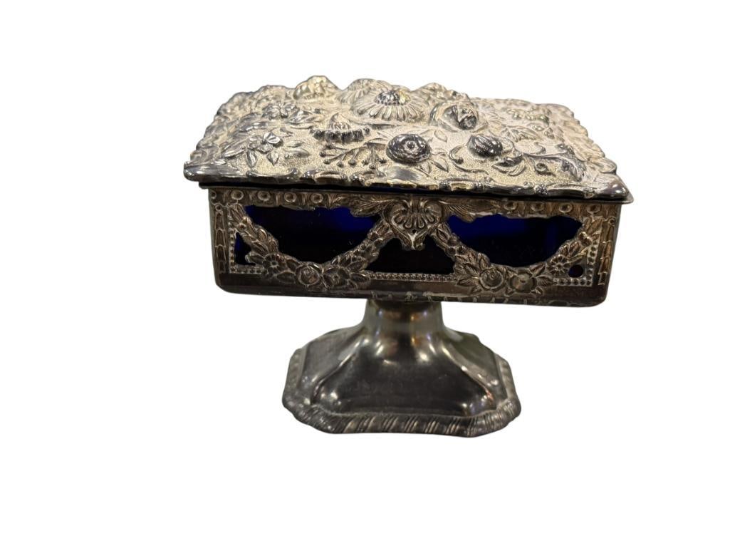 ORNATE SILVER FINISH METAL FLORAL DECORATED TRINKET BOX WITH COBALT BLUE GLASS LINER MADE IN JAPAN: TARNISHED PATINA, MARKED ON THE BOTTOM 4 1/2" X 4" X 3 1/2"