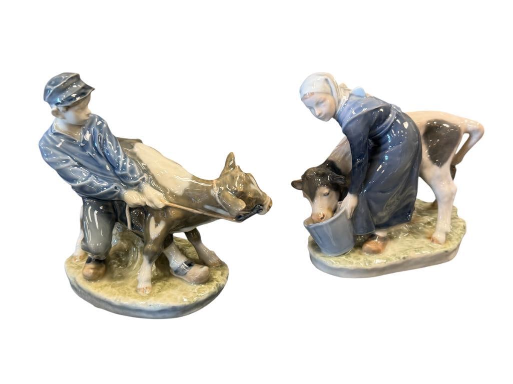 VINTAGE ROYAL COPENHAGEN VINTAGE PORCELAIN FIGURES BOY AND GIRL WITH CALVES NO. 772 AND 779: EACH FIGURE IS MARKED ON THE BOTTOM AND SIGNED, NO CHIPS OR DAMAGE ON EITHER FIGURINE 6 1/4" AND 7" H