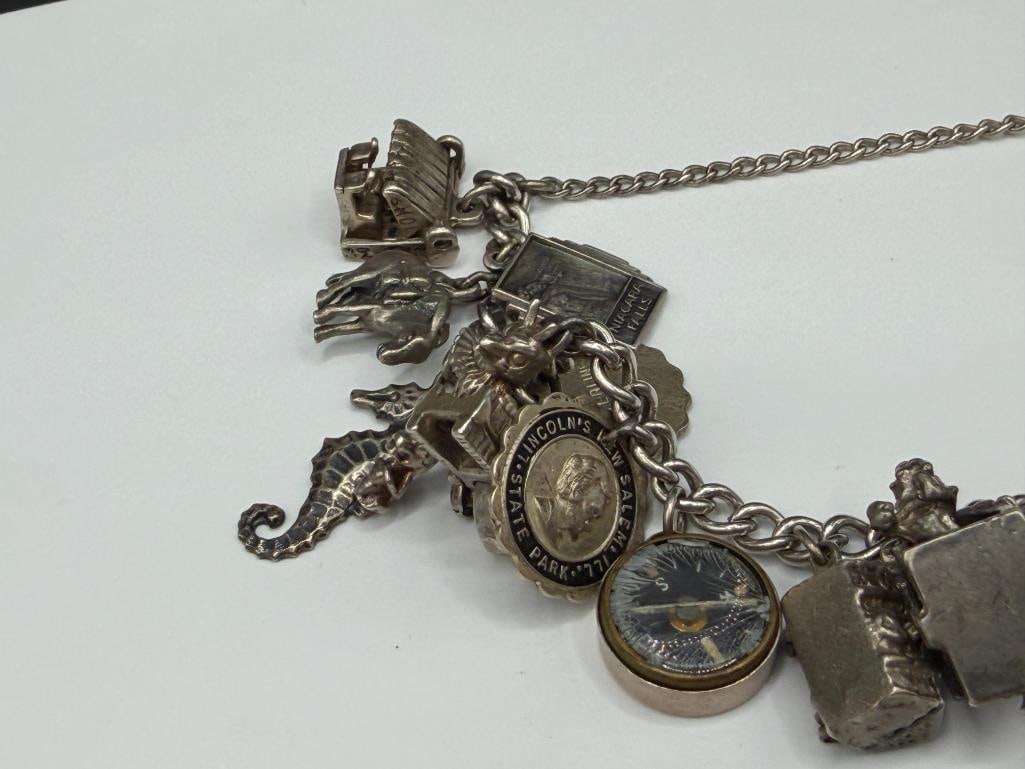 VINTAGE STERLING SILVER CHARM BRACELET FEATURING DOZENS OF STERLING SILVER CHARMS - 3