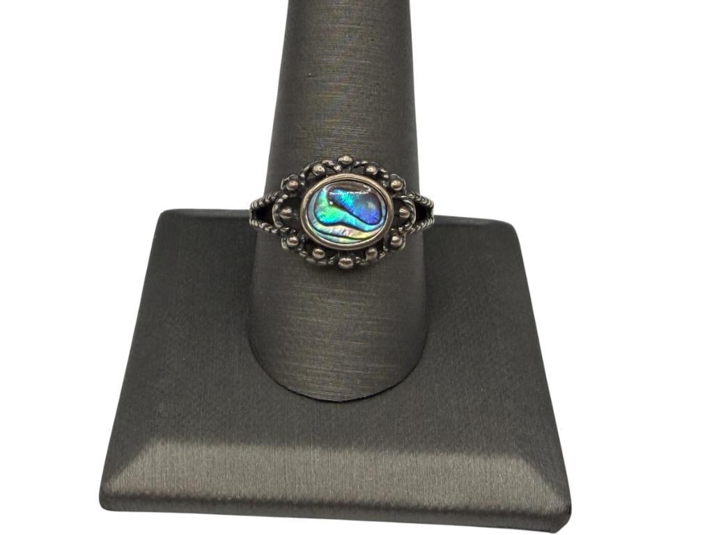 STERLING SILVER ABALONE SHELL RING: FEATURING OVAL ABALONE SHELL SET IN BEADED PIERCED DESIGN BAND SIZE 10, 1/2" FRONT, 4.22 GRAMS