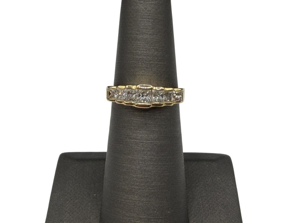 14K YELLOW GOLD PRINCESS CUT DIAMOND TAPERED DESIGN RING: FEATURING SEVEN CHANNEL SET GRADUATED PRINCESS CUT DIAMONDS, DESIGNER HALLMARKED, MARKED "996" SIZE 5 1/4, UP TO 3MM X 3MM DIAMONDS, 3/16" FRONT, 2.91 GRAMS