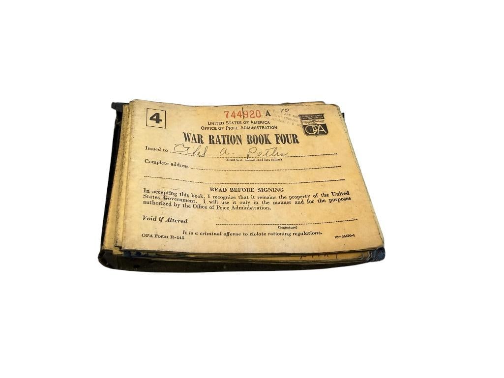 11 WORLD WAR II WAR RATION BOOKS MANY STAMPED OFFICE OF PRICE ADMINISTRATION RENO, NV: INCLUDES RATION BOOK HOLDER
