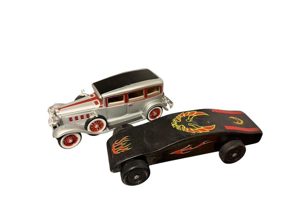 COLLECTIBLE CARS INCLUDING FIREBIRD PAINTED PINEWOOD DERBY CAR AND ANSO 1931 PEERLESS DIECAST CAR: ANSO CARS IS MISSING ONE FENDER LIGHT, FIREBIRD TRANS AM DERBY CAR IS PAINTED IN CLASSIC FIREBIRD THEME WITH WEIGHT IN BACK FIREBIRD IS 7" L
