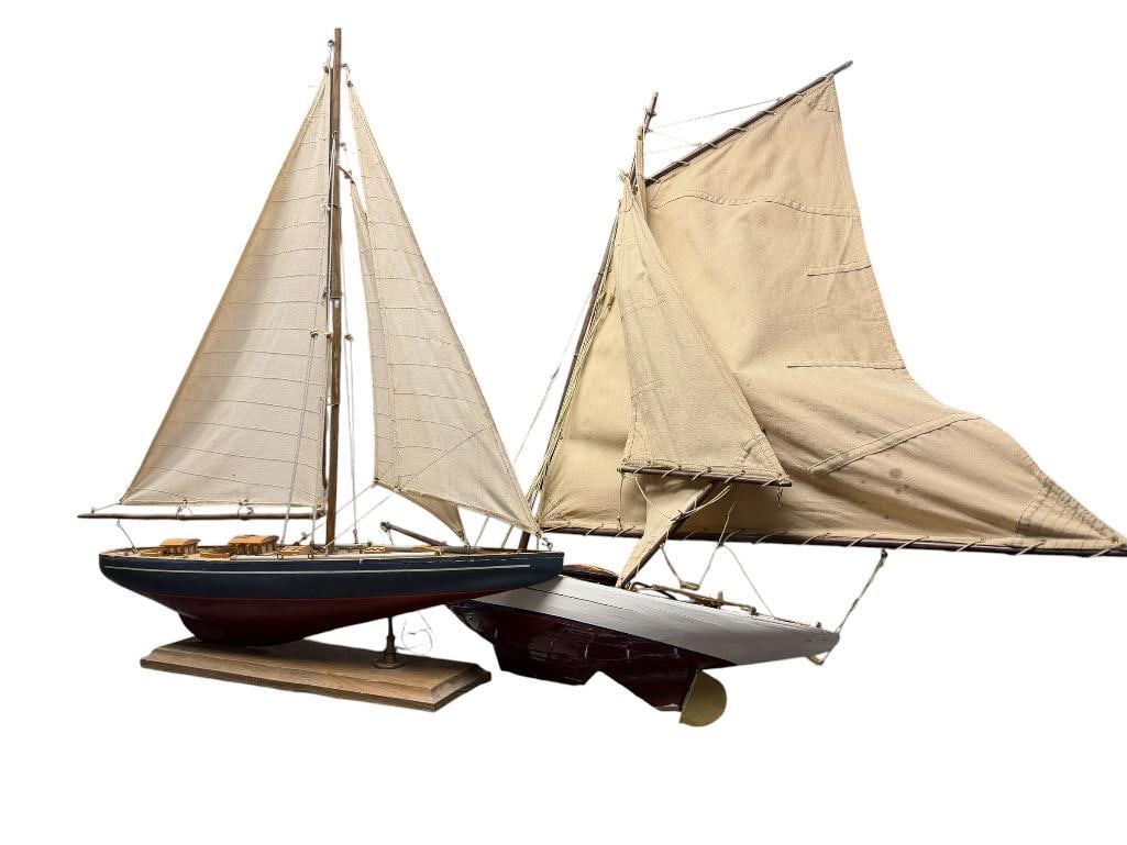 TWO VINTAGE WOODEN MODEL SAILBOATS WITH CANVAS SAILS INCLUDING ONE WITH ROYAL MOTOR YACHT CLUB BA...: NOT ACTUAL BADGE, HANDPAINTED DESIGN, BOTH IN FAIR CONDITION 30" X 5" X 30"