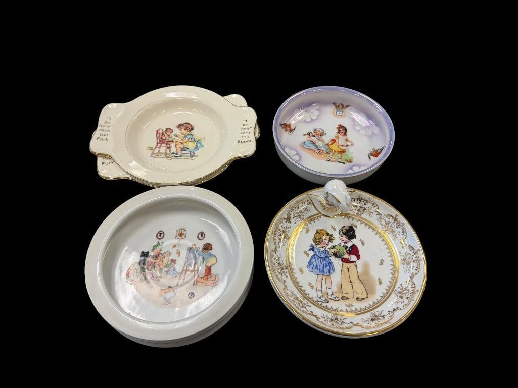 FIVE VINTAGE BABY BOWLS / PLATES INCLUDES LIMOGES BABY WARMING PLATE AND TWO HOLMES & EDWARDS PLA...: LIMOGES BABY WARMING PLATE HAS ILLUSTRATION OF BOY AND GIRL PLAYING WITH GILT ACCENTS, ILLUSTRATED LUSTER BOWL, ALL PLATES WITH ILLUSTRATIONS, ONE BOWL HAS A CHIP ON THE UNDERSIDE 6 3/4" UP TO 9"