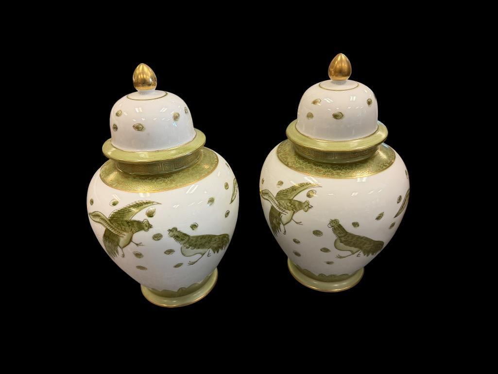 PAIR OF SADEK PORCELAIN HAND PAINTED GINGER JARS FEATURING GREEN FIGHTING PEACOCK DESIGNS: EACH JAR IS TOPPED WITH WHITE LID AND GOLD COLORED FINIAL, NO CHIPS OR CRACKS, MARKED "7804" ON BOTTOMS 10" H