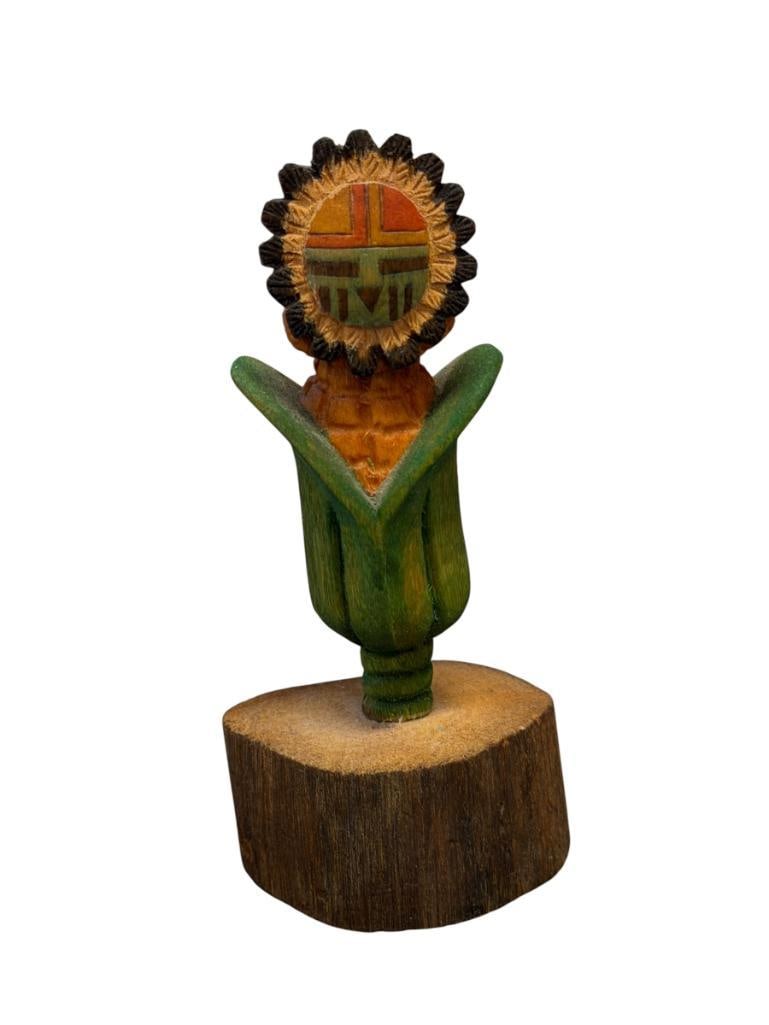 DAWA SUNFACE MINIATURE HAND CRAFTED HOPI COTTONWOOD KACHINA DOLL SIGNED "A.C.": KACHINA DEPICTS POLYCHROME SUNFACE KACHINA WITH GEOMETRIC DESIGN FACE, MOUNTED ON WOOD SLAB, MARKED ON THE BOTTOM 5" H