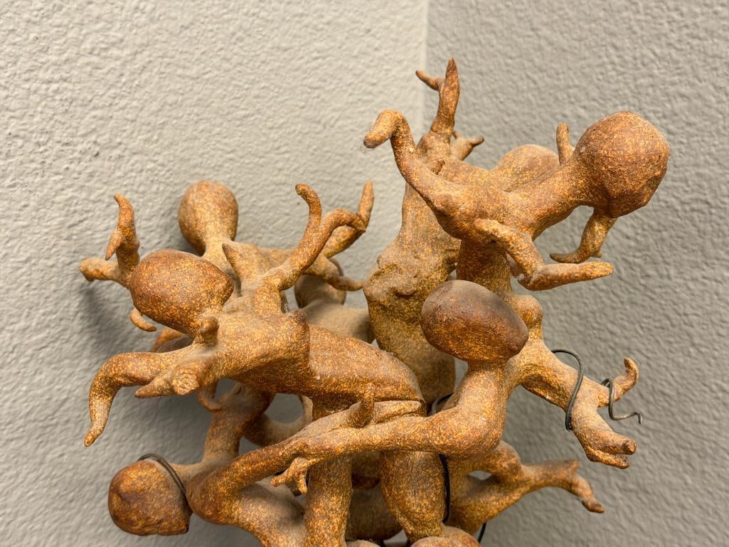 ABSTRACT CLAY SCULPTURE OF INTERTWINED FIGURES ON A ROUGH / NATURAL STONE BASE - 3