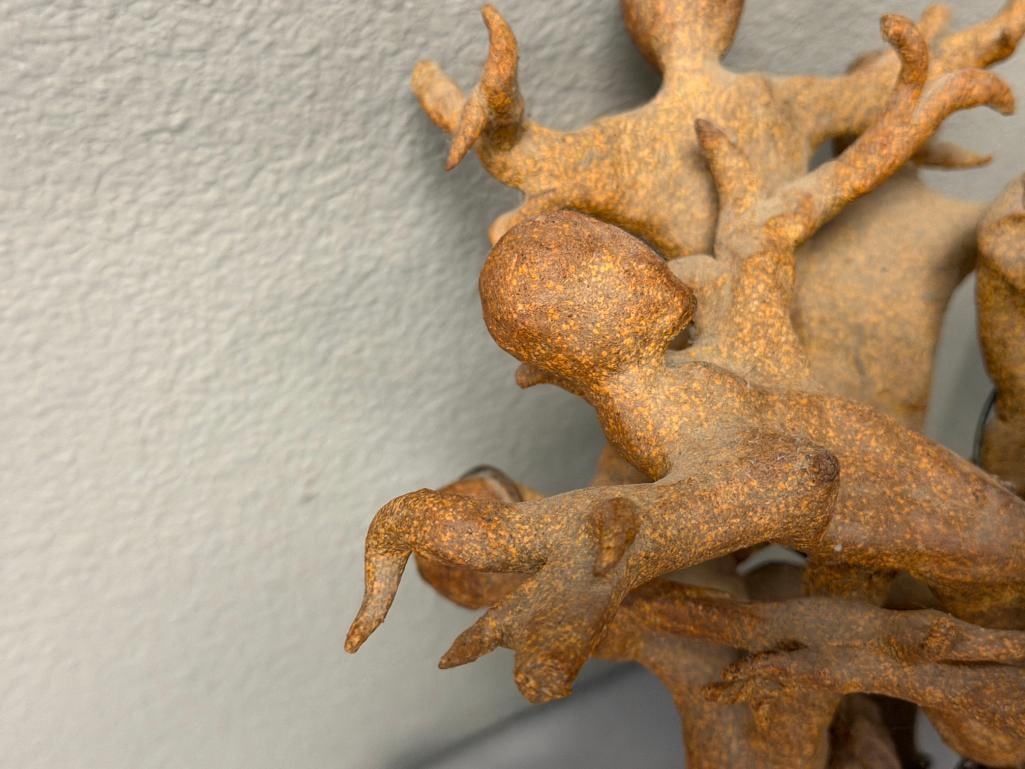 ABSTRACT CLAY SCULPTURE OF INTERTWINED FIGURES ON A ROUGH / NATURAL STONE BASE - 5