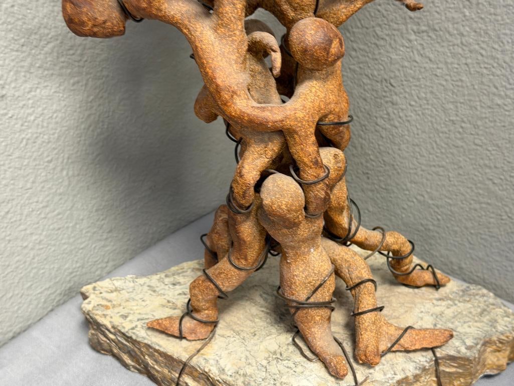 ABSTRACT CLAY SCULPTURE OF INTERTWINED FIGURES ON A ROUGH / NATURAL STONE BASE - 6
