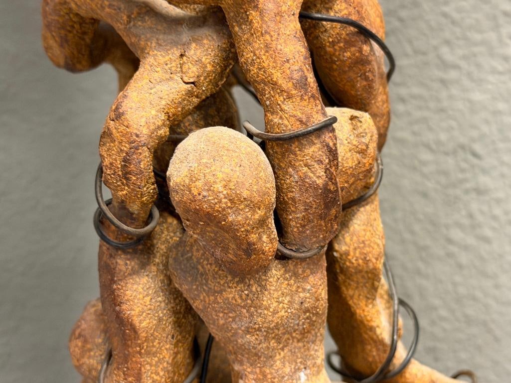 ABSTRACT CLAY SCULPTURE OF INTERTWINED FIGURES ON A ROUGH / NATURAL STONE BASE - 7