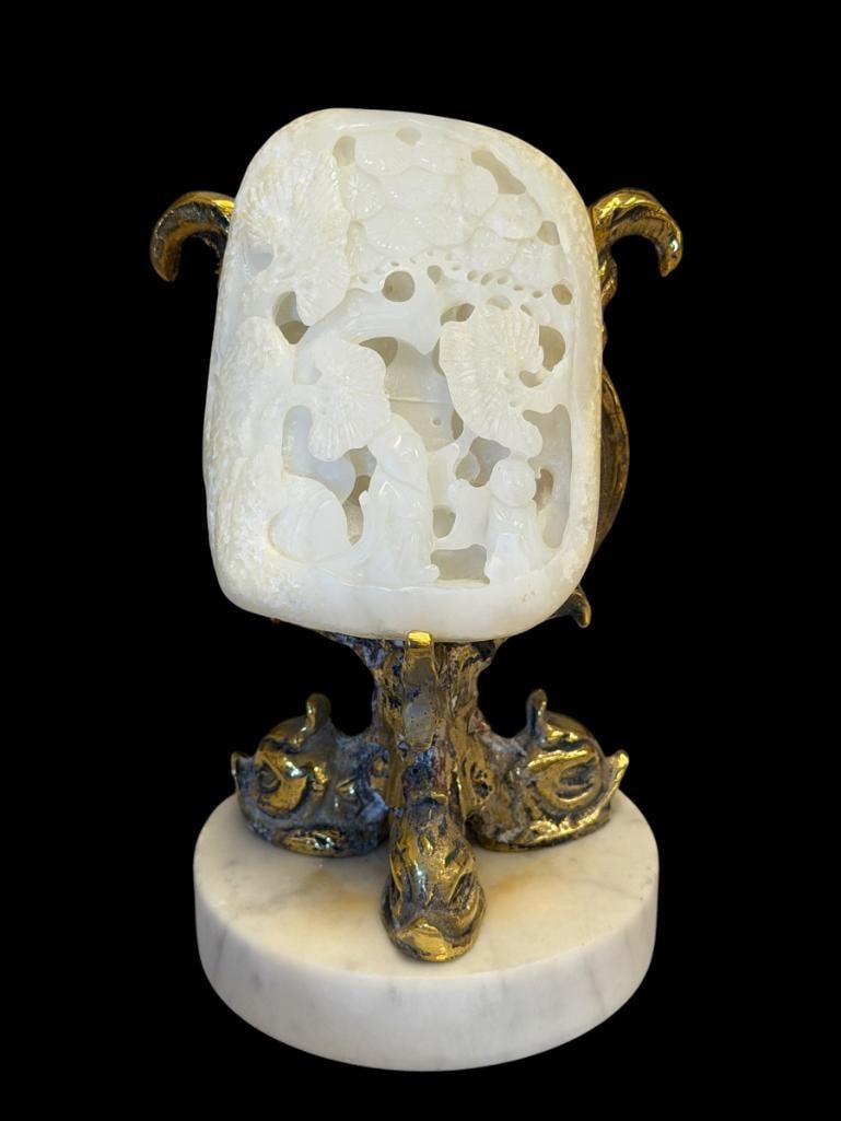 CARVED WHITE JADE 3D RETICULATED CHERRY BLOSSOM TREE AND SCHOLARS WITH BRASS AND STONE DOLPHIN ST...: 20TH CENTURY CHINESE CARVED WHITE JADE PLAQUE, INCLUDES BRASS DOLPHIN AND STONE BASE 3 /2" X 2 1/2" JADE PLAQUE, 5 3/4" H STAND