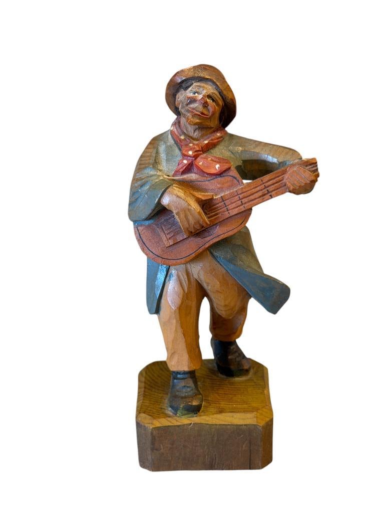 VINTAGE ANRI ITALIAN FOLK ART CARVED WOOD FIGURE OF A MAN PLAYING GUITAR: HAND CARVED WOODEN FIGURE WITH ORIGINAL LABEL ON THE BOTTOM, DAMAGE TO GUITAR 5 1/4" H