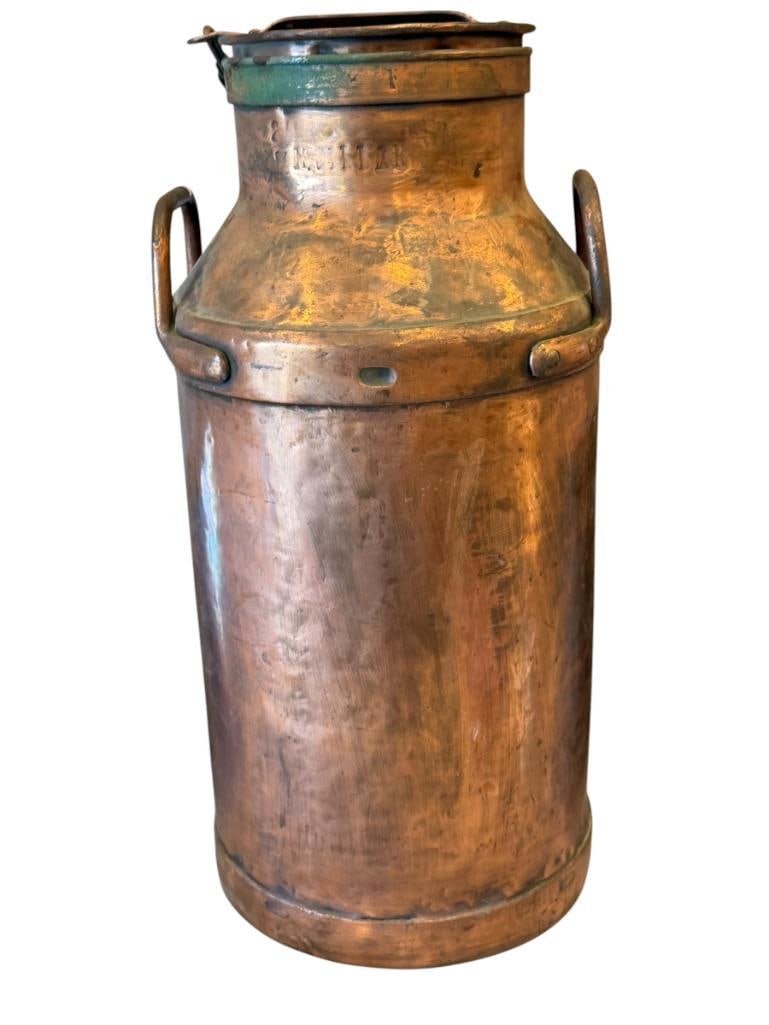 VINTAGE COPPER 40QT MILK CAN MARKED TBC AND DAIRY COMPANY: COPPER MILK CAN WITH DUAL HANDLES AND CHAINED TOP LID, FAINT STAMPED MARK NEAR TOP RIM, ALSO STAMOPED ON THE TOP WITH TBC 23" H