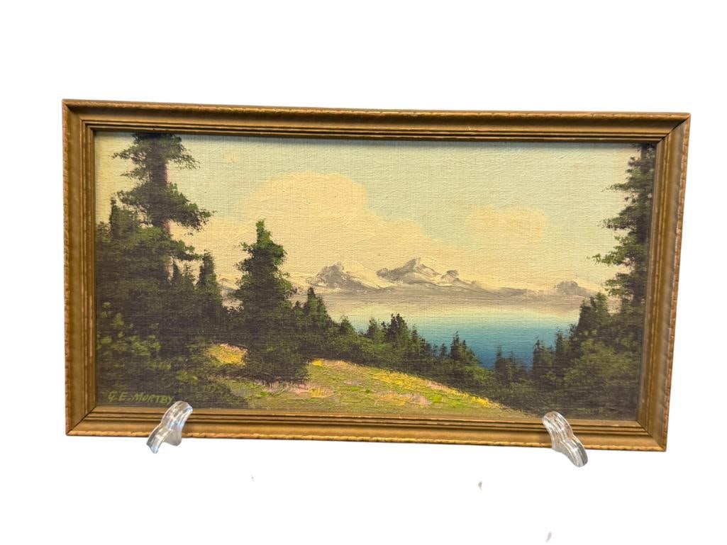 GEOFFREY E. MORTBY 20TH CENTURY AMERICAN ARTIST ORIGINAL MINIATURE OIL PAINTING ON CANVAS BOARD: ART DEPICTS MOUNTAIN LANDSCAPE WITH SNOW-CAPPED MOUNTAINS IN THE BACKGROUND, SIGNED LOWER LEFT, GIVEN MR. AND MRS. MORRENHOUSE, DATED 1943, FRAMED 10 1/4" X 5 3/4" FRAME
