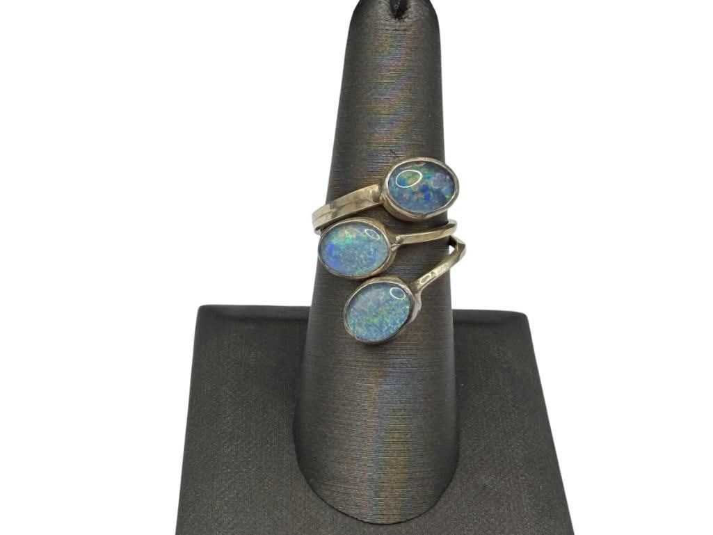 VINTAGE NATIVE AMERICAN DESIGN GETCO INC. STERLING SILVER OPAL RING: SIGNED BY MAKER AND DATED 1985, SIGNED BY ARTIST "LJ", FEATURES THREE OVAL CABOCHON OPALS SIZE 8 BUT ADJUSTABLE, 1" FRONT, 8MM OPALS, 3.88 GRAMS
