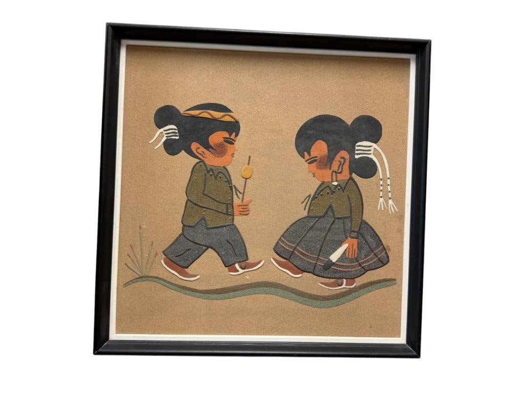 TINA W. FARMINGTON, NM NAVAJO ARTIST SAND ART PAINTING NAVAJO BOY AND GIRL WALK IN A BEAUTY WAY: ART DEPICTS NAVAJO BOY AND GIRL WALKING, MADE FROM NATURAL COLORED SAND AND ROCK FORMATION, SIGNED ON THE BACK, FRAMED 17 1/2" X 17 1/2" FRAME