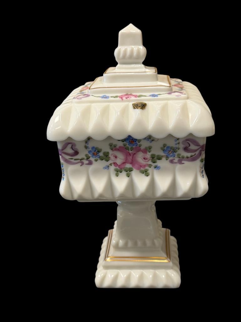 1970'S WESTMORELAND AMERICAN GLASS CO. HAND PAINTED MILK GLASS COVERED JAR BY R. BUSATO: R. BUSATO WAS A RESIDENT ARTIST AT WESTMORELAND IN THE 1970'S, SQUARE MILK GLASS JAR WITH FLORAL AND RIBBON DESIGN WITH GILT BANDS, SIGNED ON THE BOTTOM, ORIGINAL STICKER PRESENT, NO DAMAGE OR