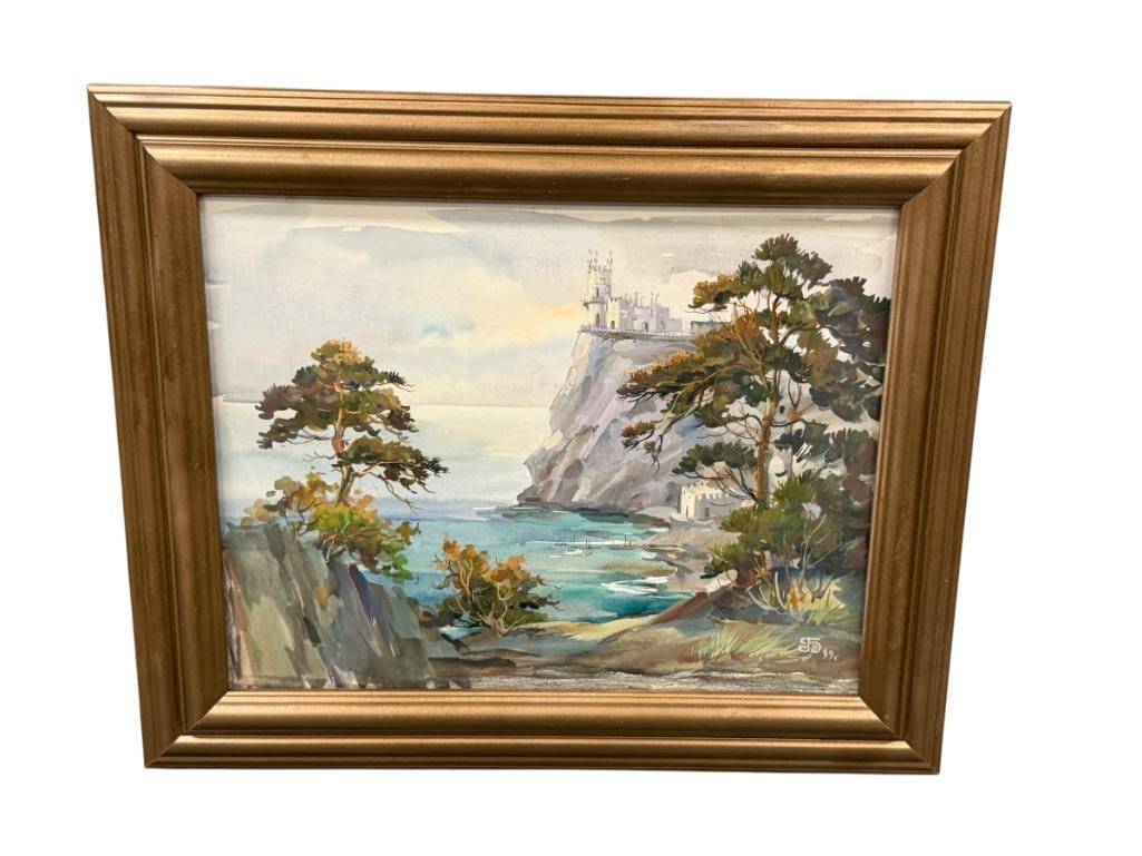 1999 SIGNED ORIGINAL WATERCOLOR ON PAPER PAINTING DEPICTS CASTLE ON THE EDGE OF A CLIFF: SIGNED LOWER RIGHT, ALSO SIGNED ON THE BACK, FRAMED 17 1/2" X 14 1/2" FRAME