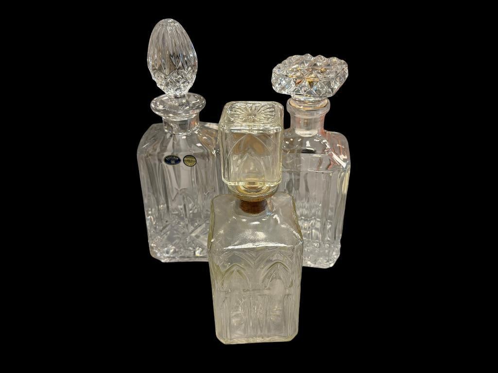 GLASS AND TWO CRYSTAL DECANTERS WITH STOPPERS: 9 3/4" AND 12" H