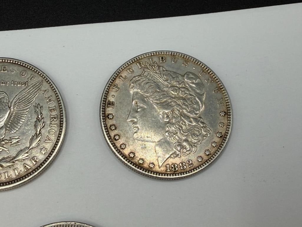 FIVE U.S. MORGAN SILVER DOLLARS FEATURING VARIOUS DATES AND MINT MARKS - 10