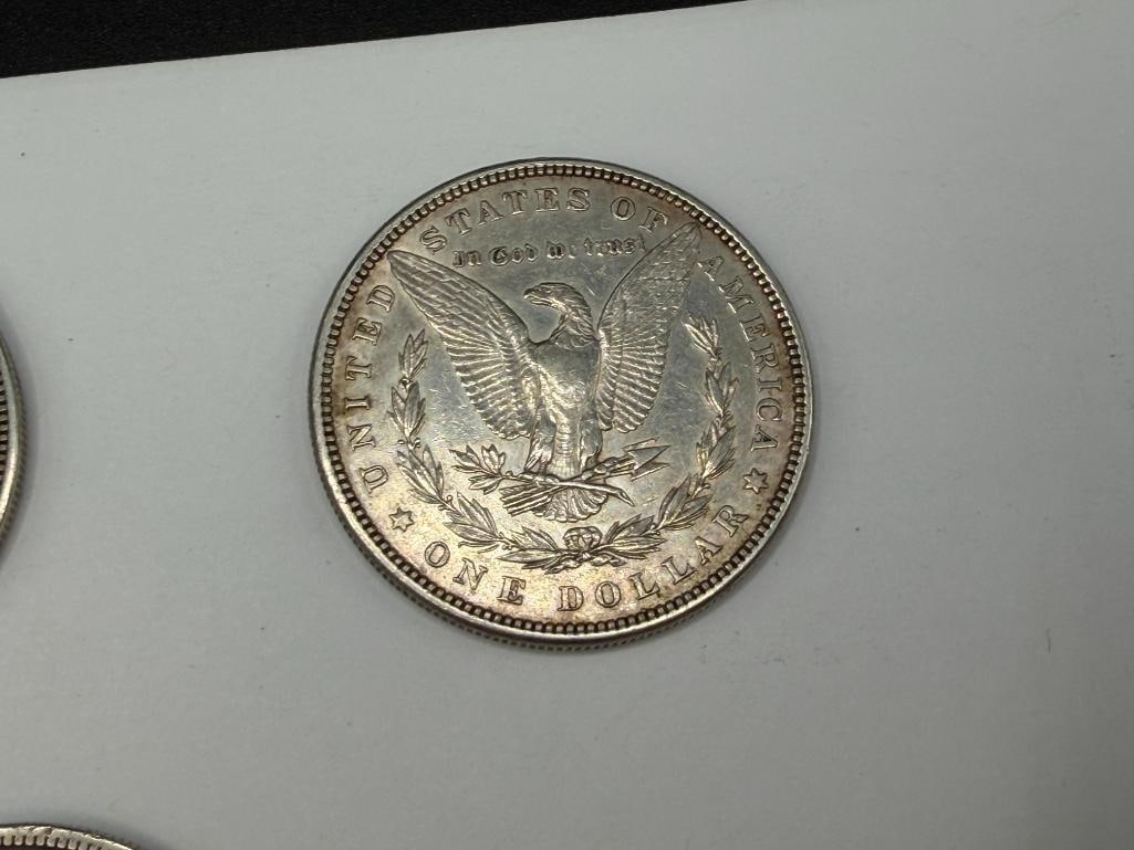 FIVE U.S. MORGAN SILVER DOLLARS FEATURING VARIOUS DATES AND MINT MARKS - 12