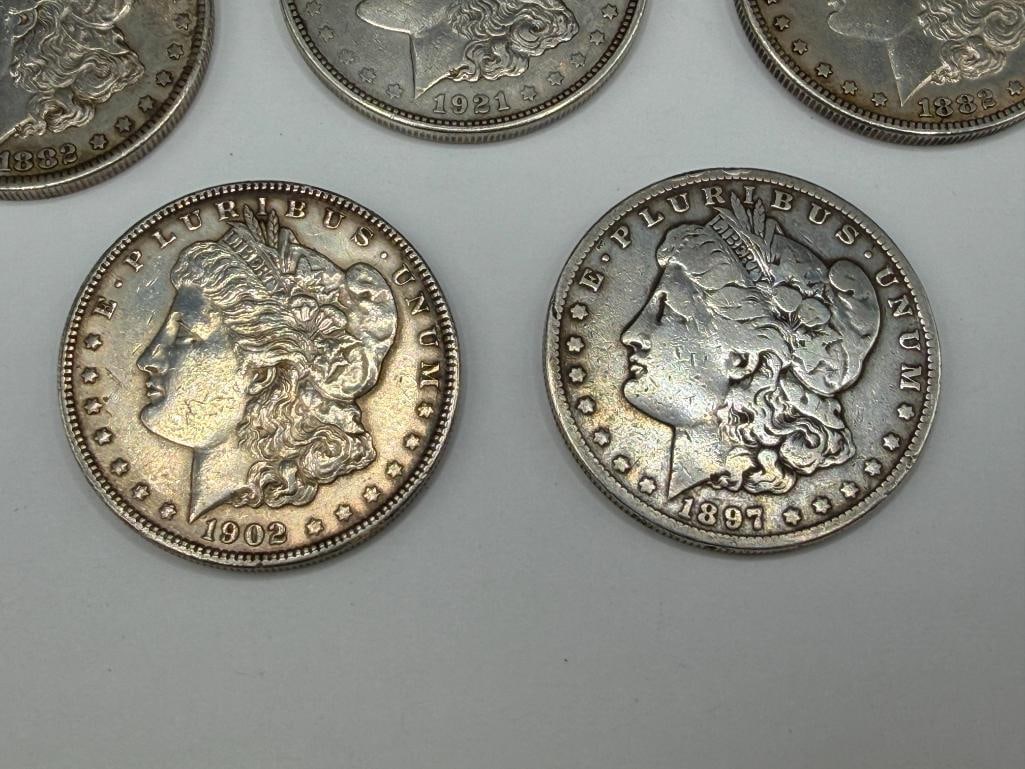 FIVE U.S. MORGAN SILVER DOLLARS FEATURING VARIOUS DATES AND MINT MARKS - 2