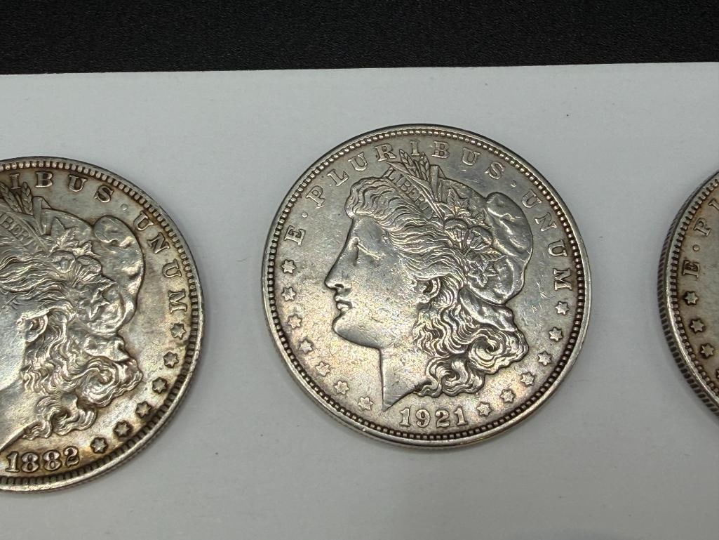 FIVE U.S. MORGAN SILVER DOLLARS FEATURING VARIOUS DATES AND MINT MARKS - 7