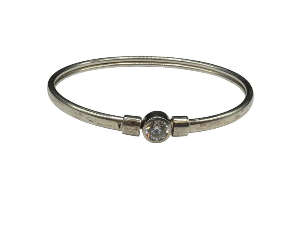 STERLING SILVER CZ BANGLE BRACELET FEATURING AN OVAL CUT CZ: HALLMARKED BY DESIGNER 2 1/2" BANGLE WRIST WIDTH, 6MM CZ, 7.75 GRAMS