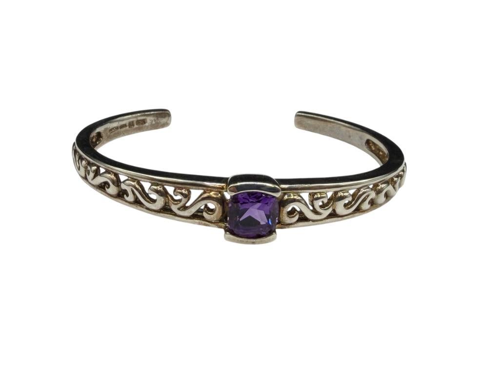 STERLING SILVER BRILLIANT CUT AMETHYST CUFF BRACELET FEATURING PIERCED SCROLL DESIGN: HALLMARKED BY DESIGNER 2 1/2" CUFF WRIST WIDTH X 1/2" FRONT, 9MM AMETHYST, 24.78 GRAMS
