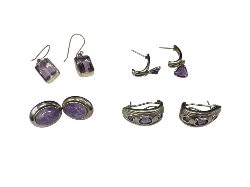 FOUR PAIRS OF STERLING SILVER AMETHYST FASHION EARRINGS: FEATURING VARIOUS CUTS OF AMETHYSTS, OMEGA CLIP-BACKS, POST EARRINGS DO NOT INCLUDE BACKS 30.58 GRAMS