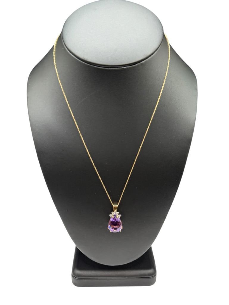 10K YELLOW GOLD PEARL CUT AMETHYST AND DIAMOND PENDANT NECKLACE: PENDANT IS STRUNG FROM 10K YELLOW GOLD NECKLACE 18" NECKLACE, 1" PENDANT, 3.55 GRAMS, 16MM X12MM AMETHYST, 1MM DIAMONDS