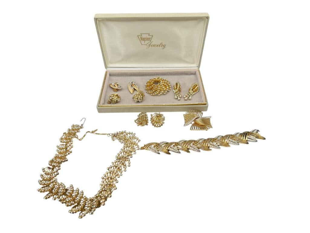 ASSORTED GOLD TONE COSTUME JEWELRY INCLUDING SOME SIGNED PIECES BY BOUCHER: ALSO INCLUDES RHINESTONE NECKLACE, BRACELET, AND SEVERAL CLIP-BACK EARRINGS, IN NAPIER JEWELRY CASE
