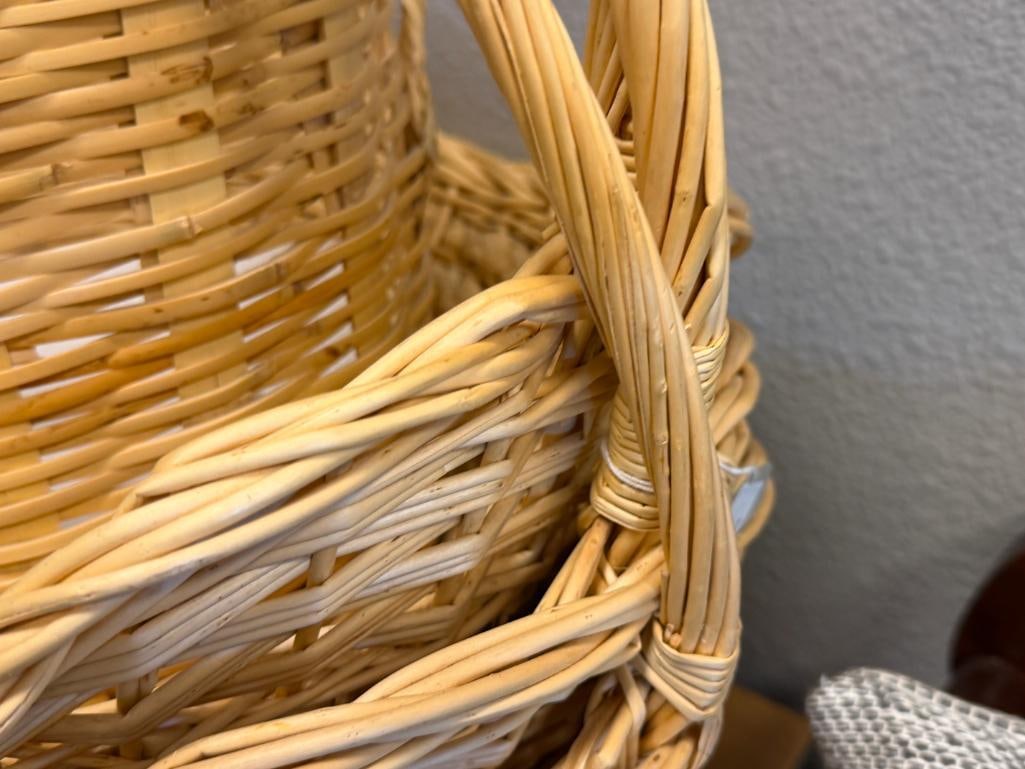 FOUR WICKER BASKETS, THREE WITH ELONGATED HANDLES, ONE IS WASTE BASKET - 16